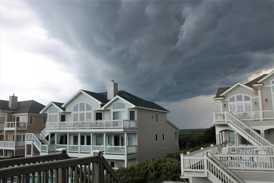 Dark storm clouds rolling over a residential neighborhood - Houston hurricane preparation