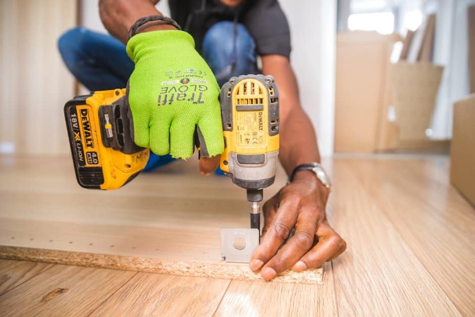Handyman using power drill for home improvement
